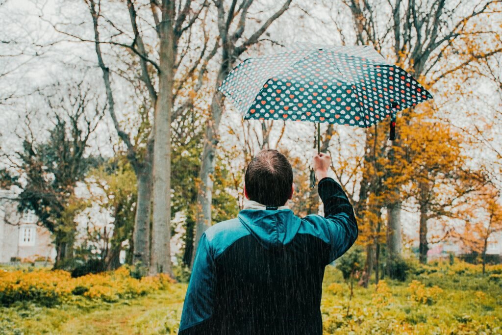 Red umbrella on dark water, a symbol of do you need umbrella insurance
