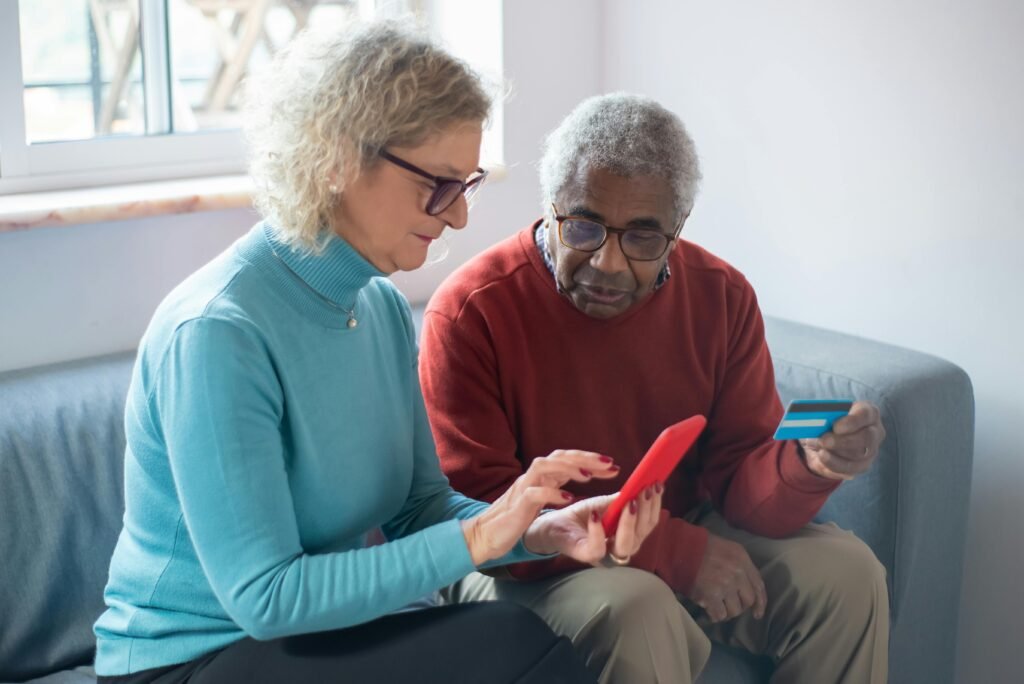 Senior couple reviewing their social security benefits on a phone