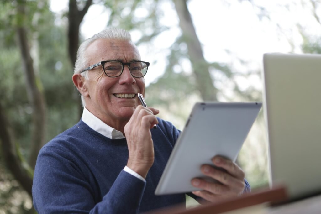 Person planning retirement savings with Roth IRA and Traditional IRA documents