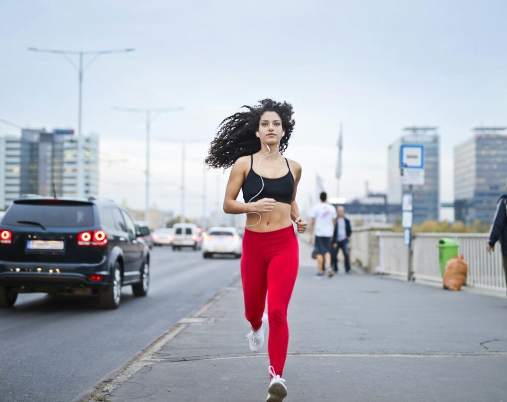 Woman running in the city, still broke after a raise but moving forward