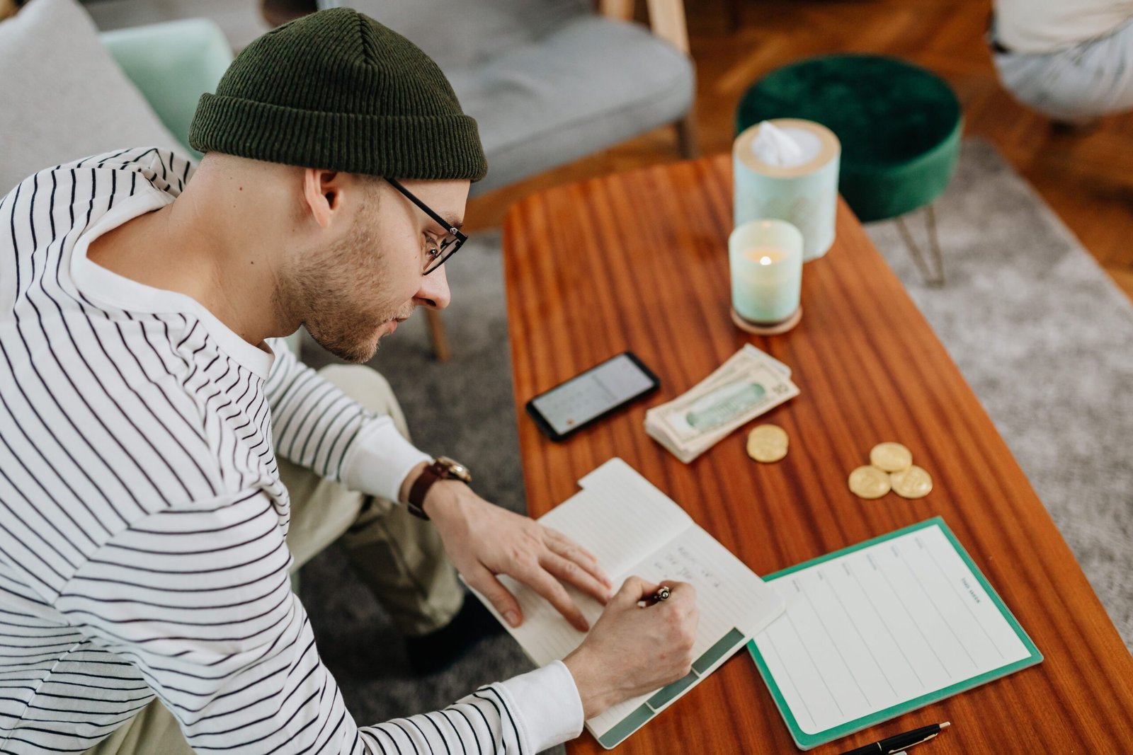 Man budgeting at a table to plan his W-4 withholding