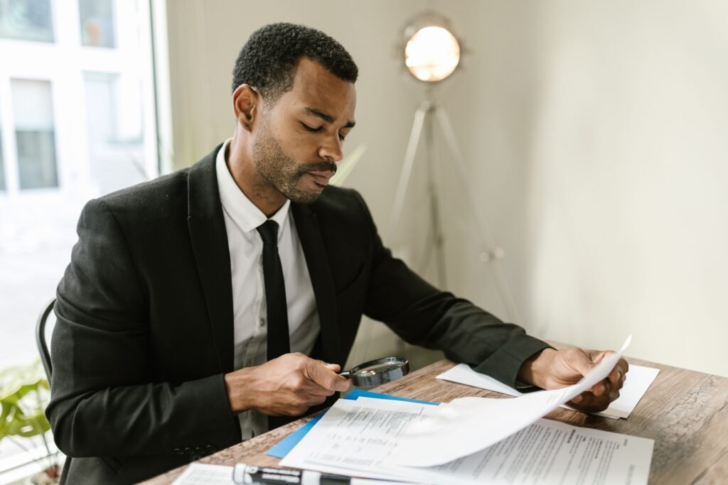 How to dispute a credit report error — person reviewing credit report and writing dispute letter