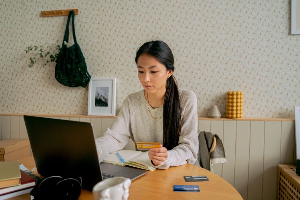 What is a balance transfer — person calculating credit card interest savings before transferring debt