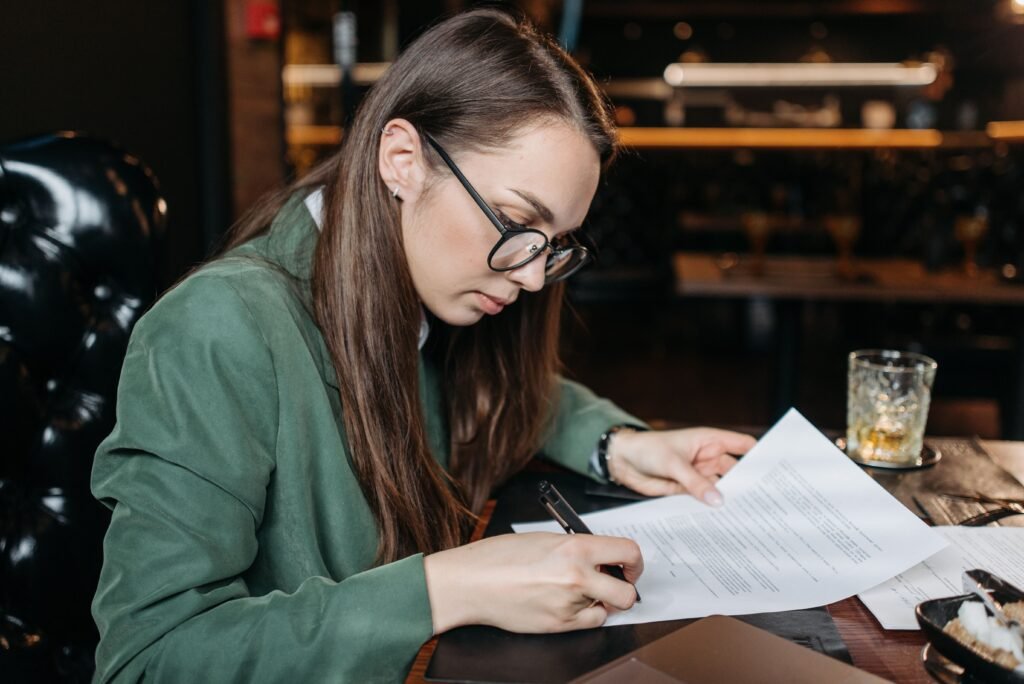 debt consolidation loan comparison with calculator, credit cards and documents on a desk