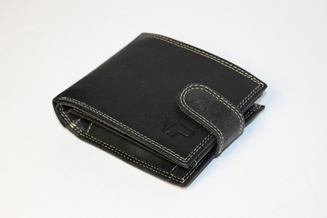 Black leather wallet, the everyday spending side of a savings account vs checking account choice