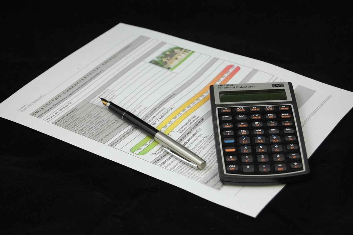Calculator and loan documents to estimate closing costs