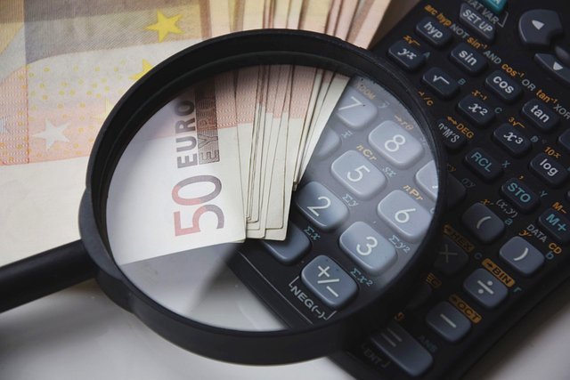 Calculator and money, working out what is a balance transfer will cost