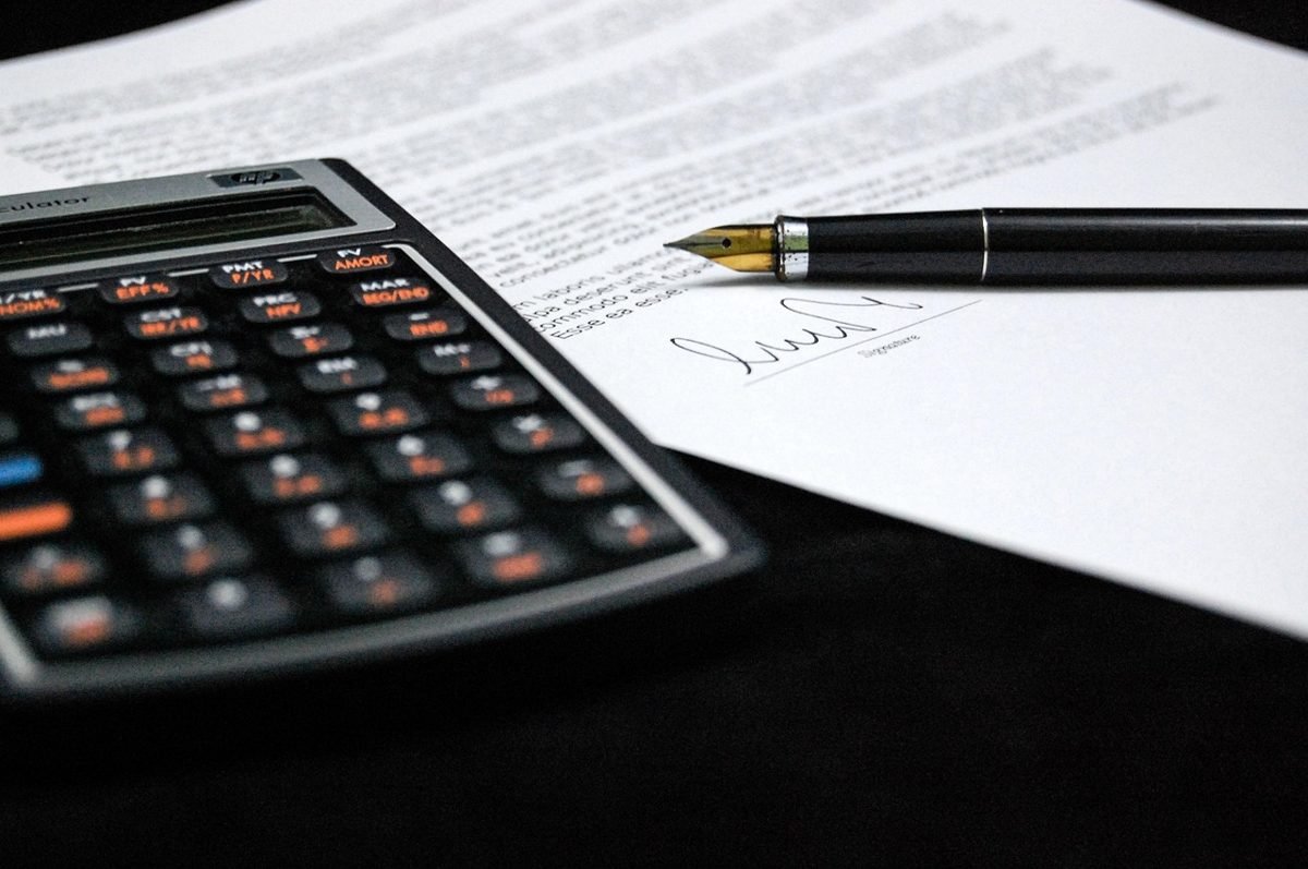 Calculator and loan documents for a low down payment mortgage