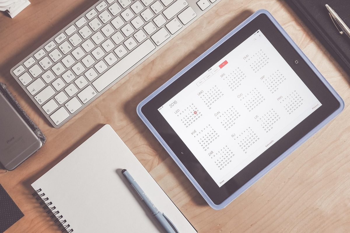 Calendar and tablet for planning a Roth IRA under 30