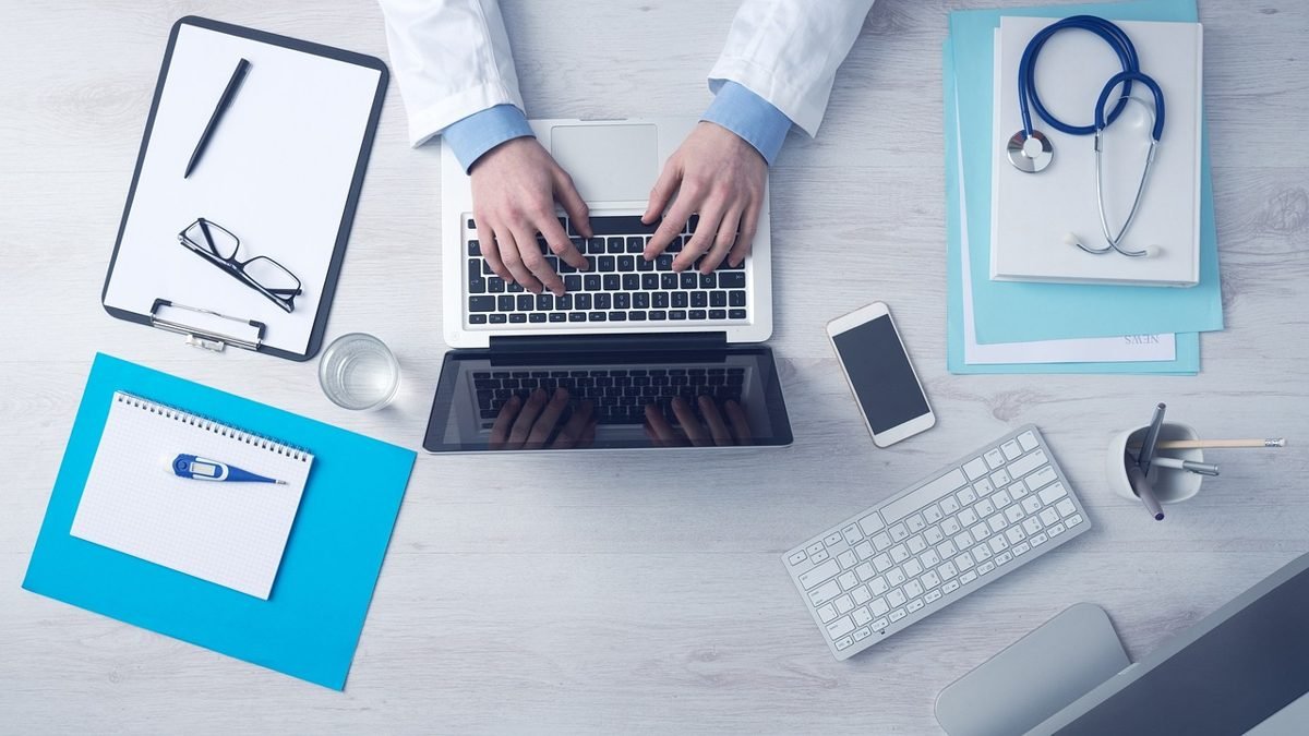 Doctor desk with laptop and stethoscope: do you need disability insurance coverage for medical claims