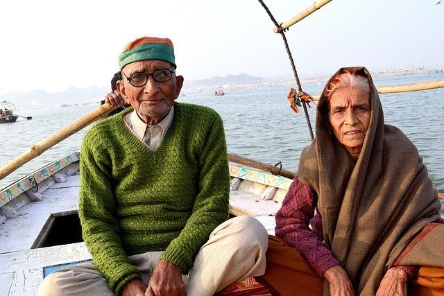 Elderly couple smiling together, retirement funded within the limits