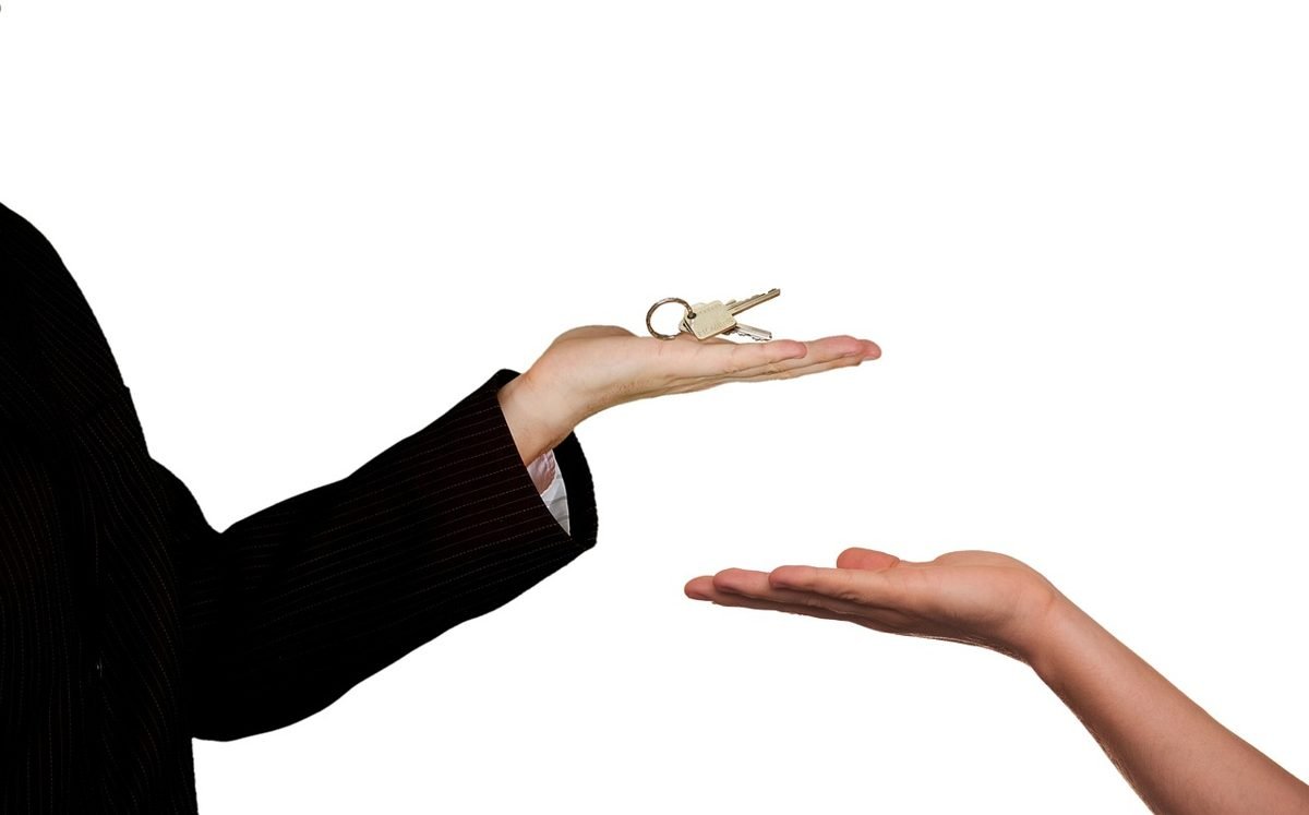 Handing over house keys after a mortgage pre-approval leads to a purchase