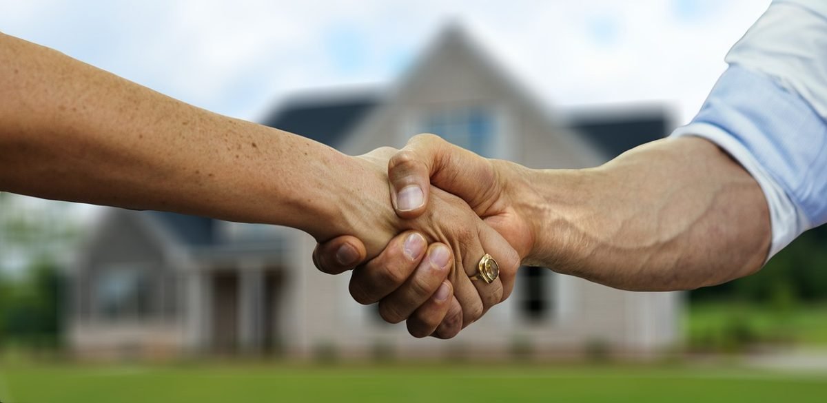 Handshake after a competitive offer on a house is accepted