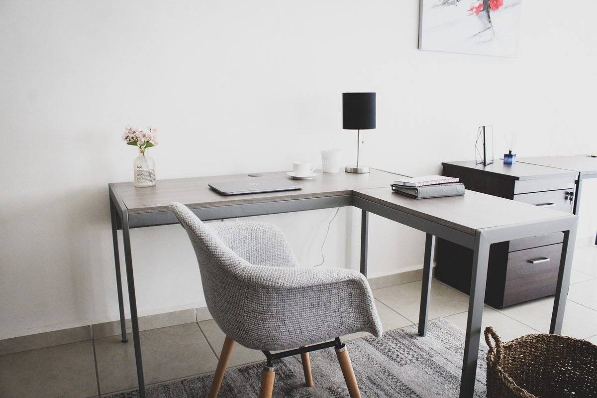 Home office desk of a freelancer budgeting for self-employed health insurance
