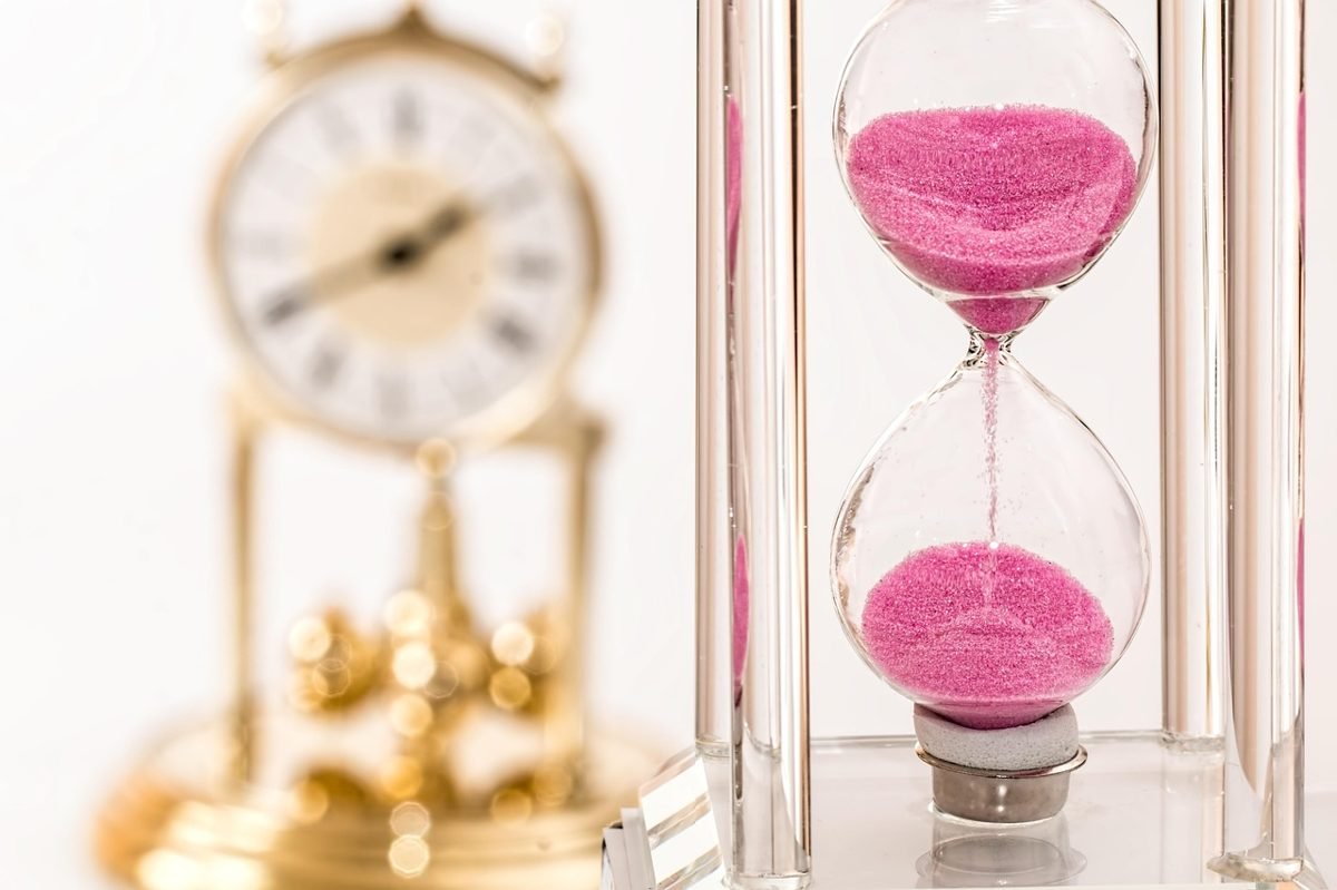 Hourglass showing how time powers compound interest