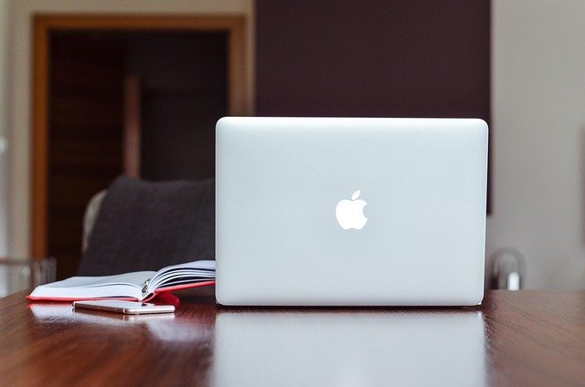 Laptop on a home desk, ready for a side hustle to full-time move