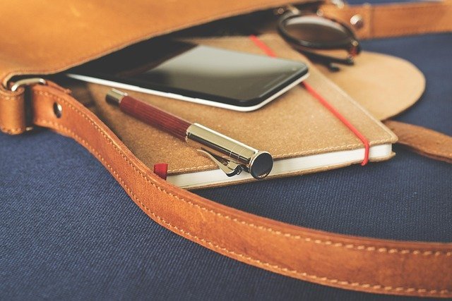 Notebook and phone for an annual review that prevents insurance mistakes