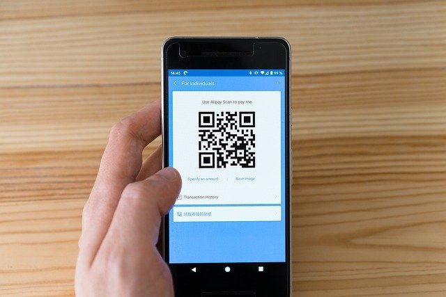 Phone showing a QR code, one way to pay with a buy now pay later provider