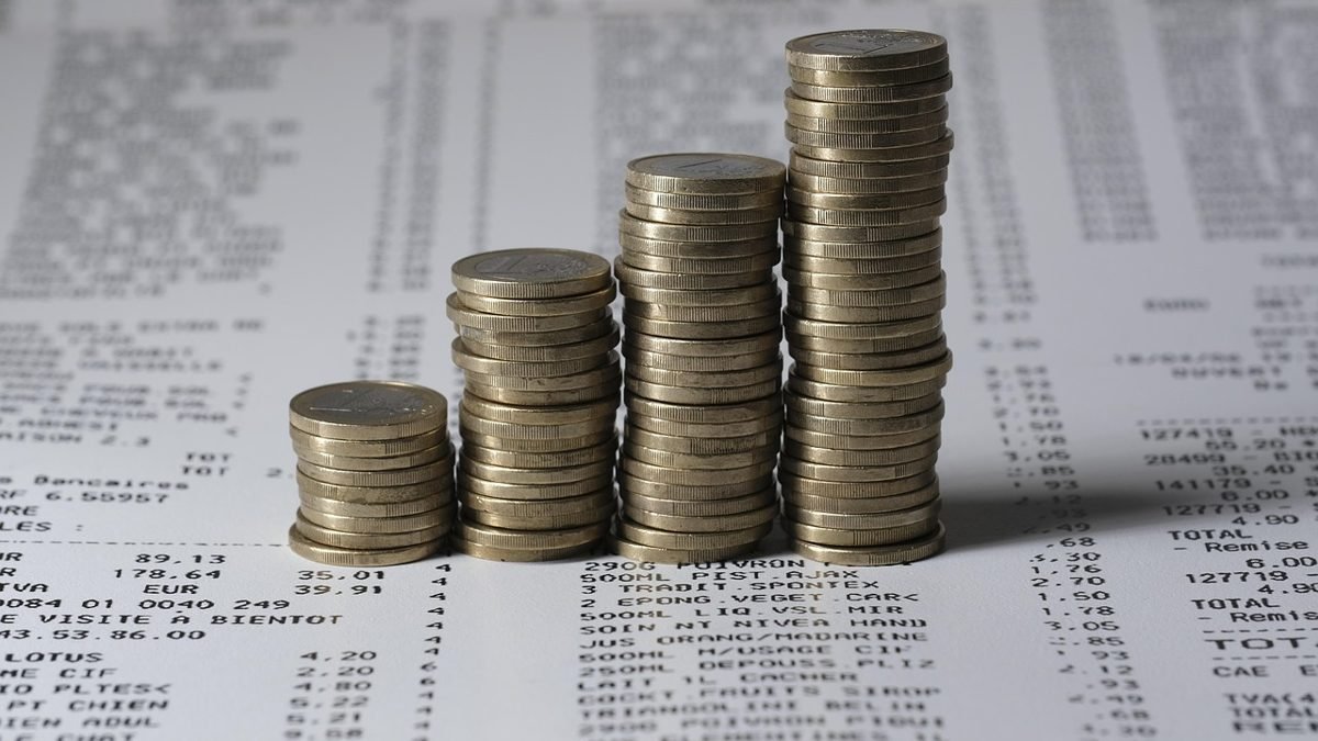 Rising stacks of coins illustrating compound interest over time