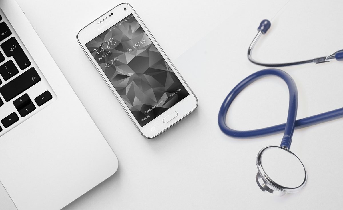 Stethoscope and phone, comparing self-employed health insurance plans