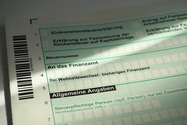 Tax return form and money, where capital gains tax is reported