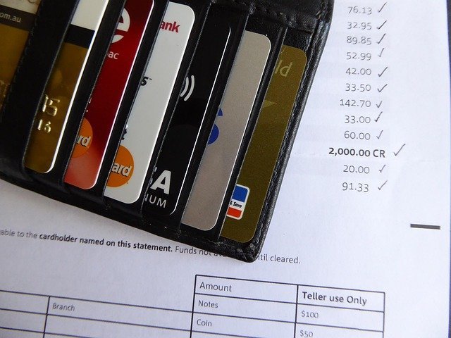 Wallet with cards on a statement, what a credit freeze vs credit lock protects