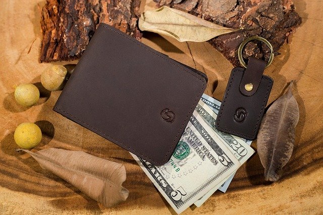 Wallet with dollar bills, the debt a balance transfer moves
