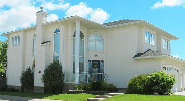 White two-story house used in the worked cash out refinance example